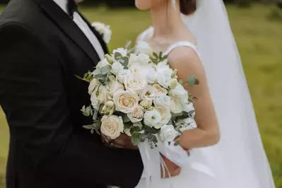 bride and groom hugging outdoors